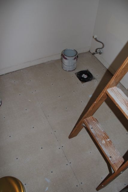 The newly installed cement board subfloor